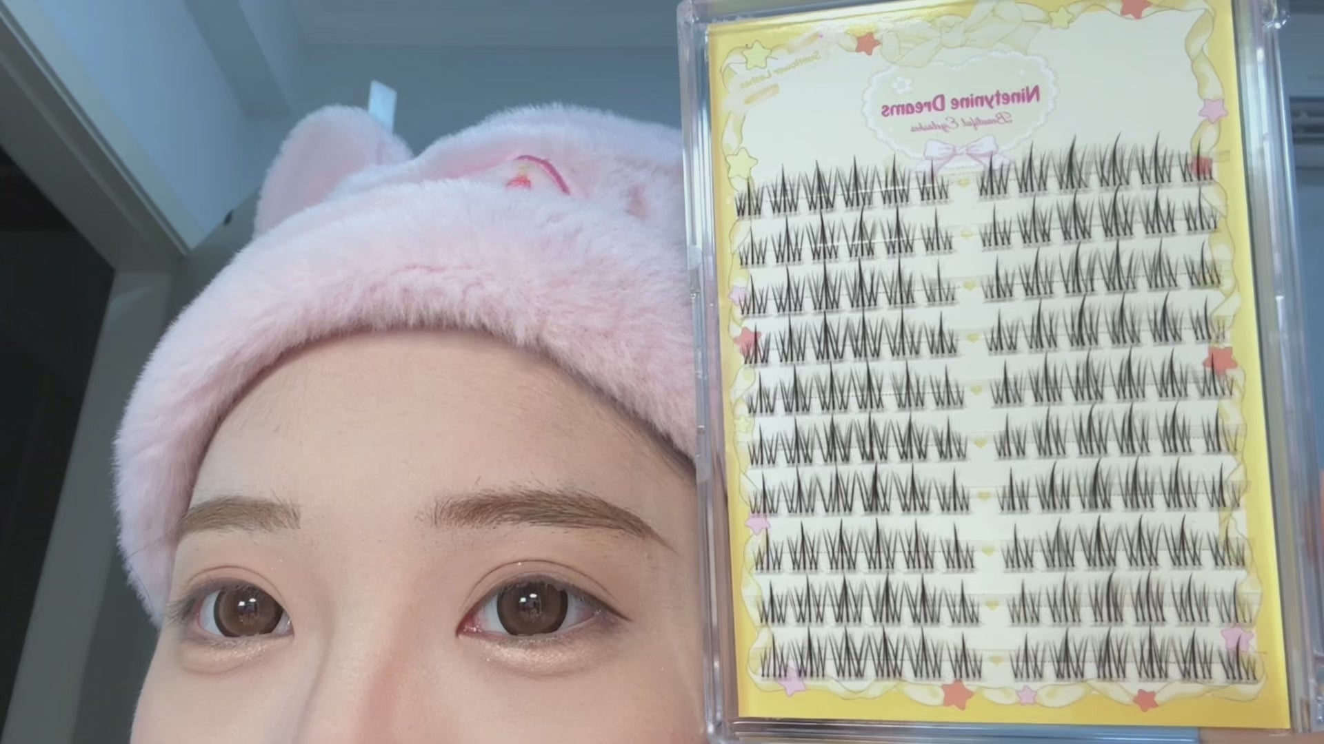 Video of a person trying on 120PCs Sunflower Lashes, showcasing a natural, daily lash look with 8-13mm length for a subtle yet enhanced appearance